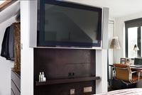 Wall mounted television in bedroom suite