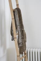 Scarves on wooden ladder