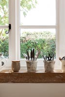 Salvaged railway sleepers used for kitchen window sill