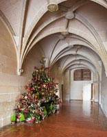 Gothic hallway with Christmas trees