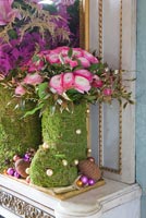 Arrangement of Roses and Astilbe in moss 'boots'