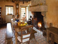 Kitchen with wooden table and fire