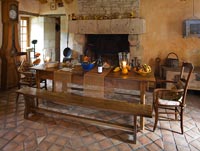 Kitchen with wooden table and fire