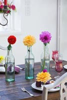 Colourful arrangement of Dahlias on dining table
