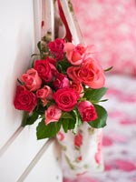 Floral fabric bag hanging from door with Roses