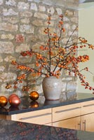 Christmas arrangement of Crabapple branches in kitchen