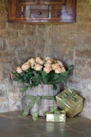 Christmas gifts and basket of Roses