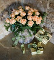 Christmas gifts and basket of Roses
