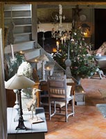 Country living room with stairs and Christmas tree