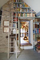 Bookshelves built in to landing walls