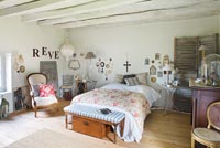 Country bedroom with vintage furniture and artefacts