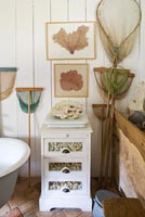Vintage bathroom with framed coral specimens