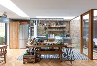 Open plan kitchen with salvaged furniture