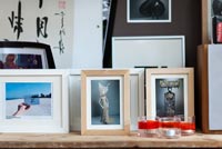 Framed photos on shelf