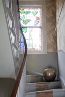 Classic staircase with stained glass window