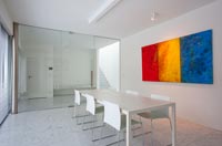 Minimal dining room with glass wall