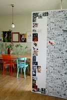 Modern dining room with photo display on door