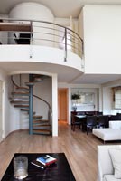 Contemporary living room with curved mezzanine