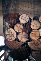 Logs stored in wire basket