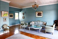 Blue living room with vintage furniture