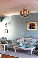 Blue living room with vintage furniture