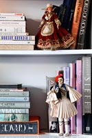 Bookshelves with Greek dolls