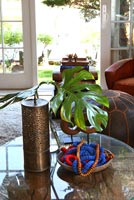 Ornate vase on glass coffee table
