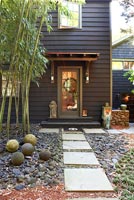 Front garden with pebbles and stone ornaments