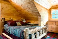 Country bedroom with rustic bed