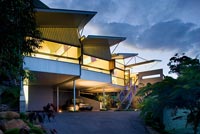 Contemporary home lit up at night