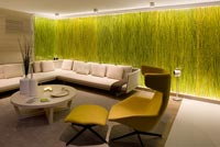 Modern living room with grass in resin feature wall