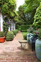 Country garden with brick path and patio
