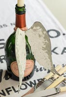 Wing decoration on champagne bottle