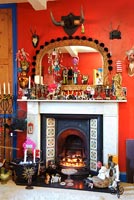 Colourful displays around period fireplace