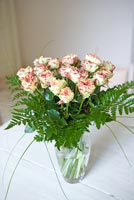Roses and Fern fronds in glass vase
