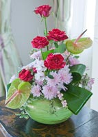 Roses, Chrysanthemum and Arum Lilies in green vase