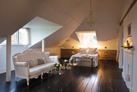 Attic bedroom with french style sofa