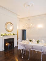 White dining room decorated for christmas