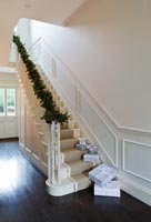 Classic hallway with christmas pine and cone garland
