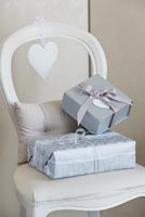 Christmas presents on white chair
