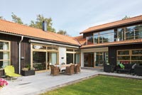 Modern timber building with decked patios
