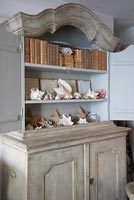 Ornate dresser with display of sea shells