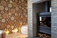 Slate fireplace and log feature wall