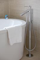 Freestanding bath and taps
