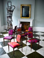 Pink chairs on checked floor