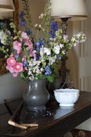 Flower arrangement in pewter jug
