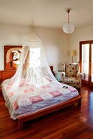 Modern bed with mosquito net 
