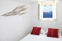 White bedroom with fish sculpture