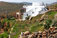 White villa on hillside, Greece