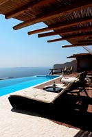 Loungers and infinity swimming pool 